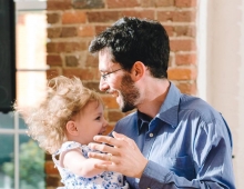 Jeff Kaufman ’08 dances with his daughter Lily